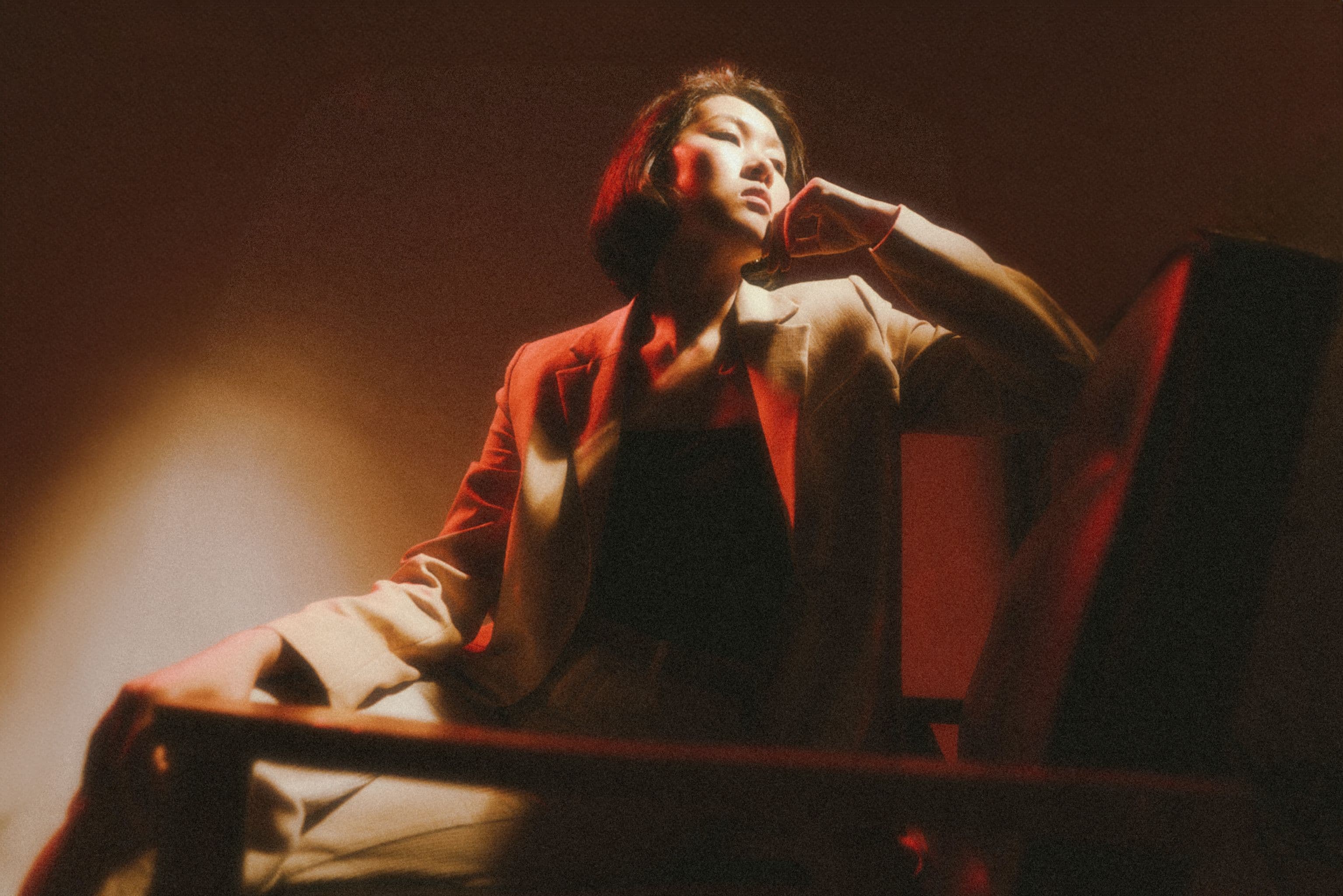 A moody, low-key lit portrait used to illustrate lighting analysis